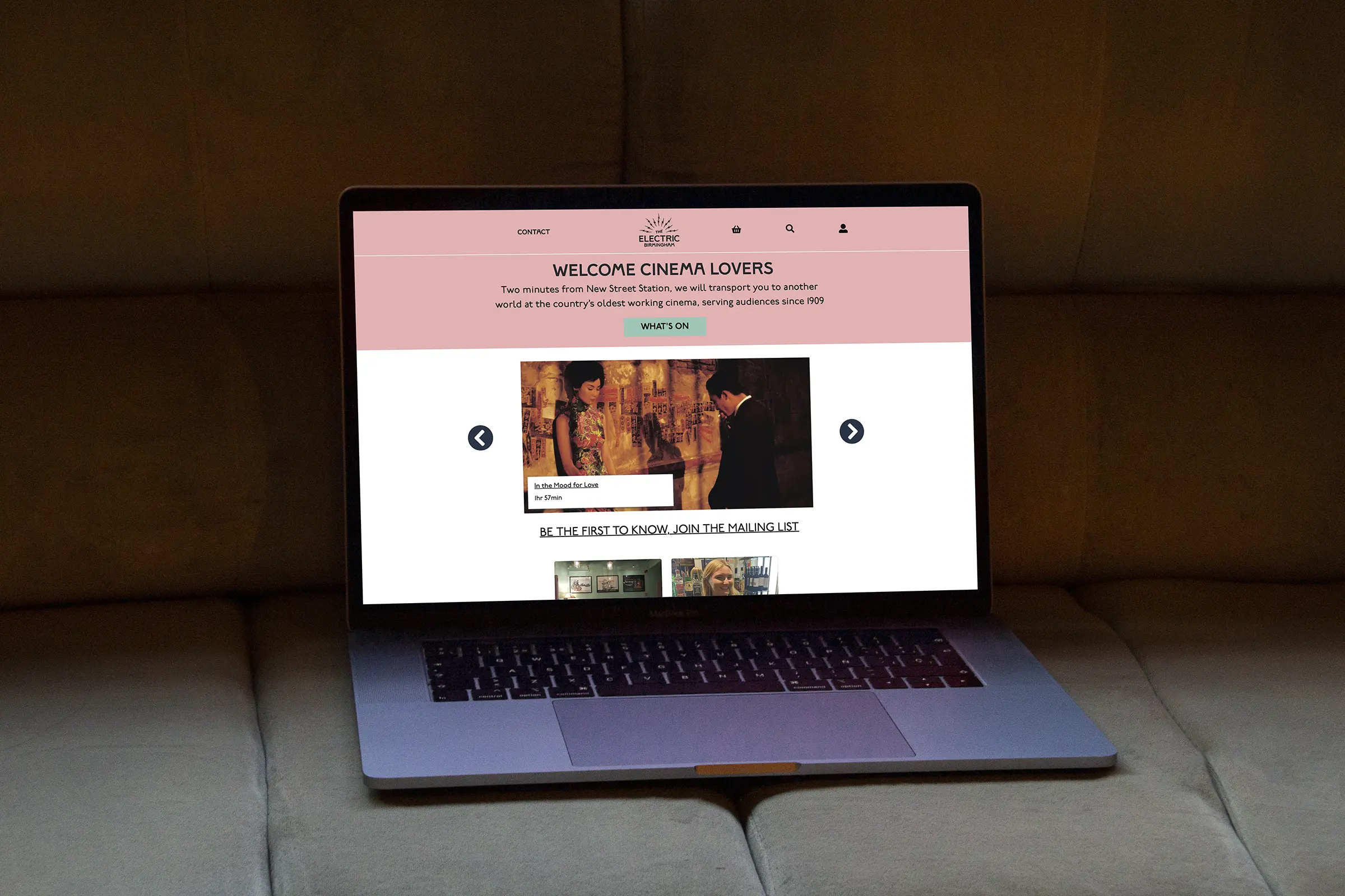 An image of a MacBook Pro laptop, at an angle on a grey surface, with the website of The Electric displayed full screen.