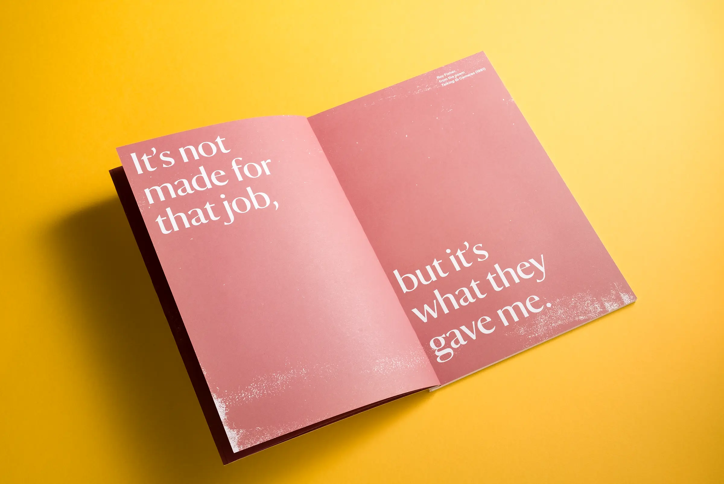 An image of a white brochure for National Trust Birmingham, lying on a bright yellow background