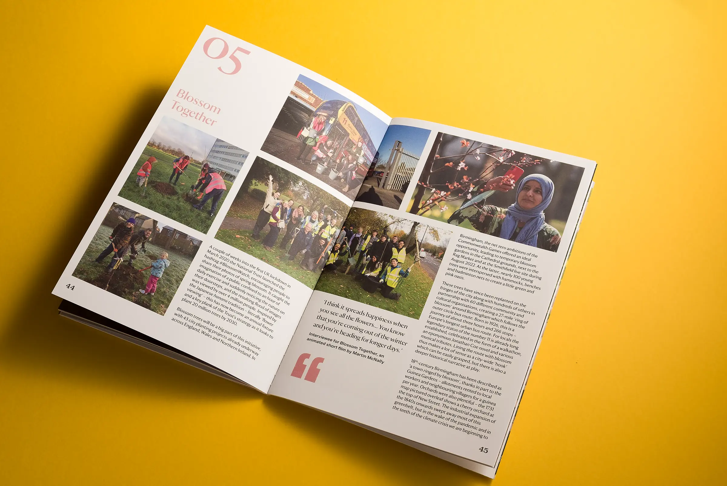 An image of a white brochure for National Trust Birmingham, lying on a bright yellow background