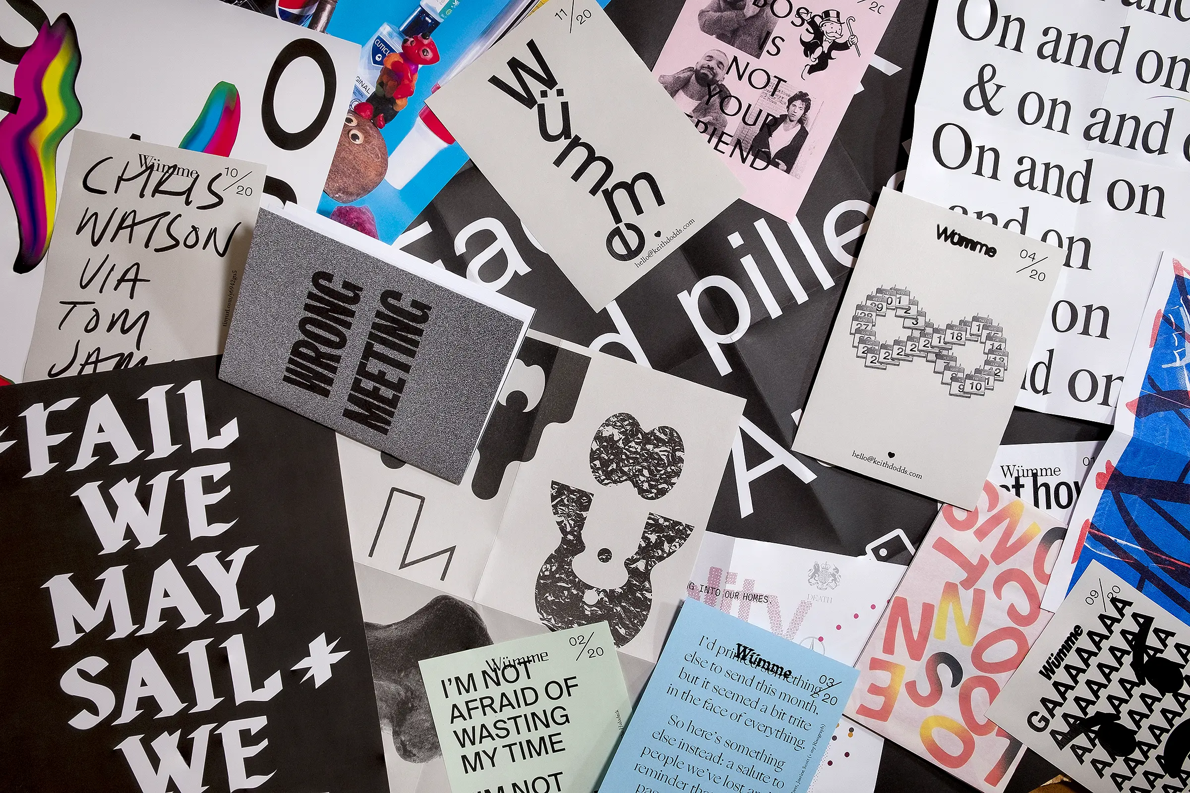 A large assortment of printed matter, scattered in a random fashion.